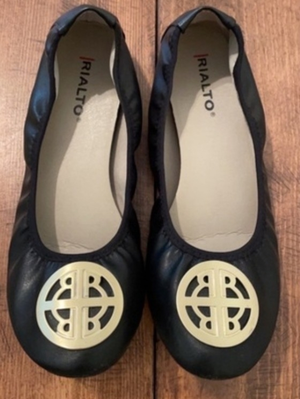 Rialto Black Ballet Flats with Gold Medallion